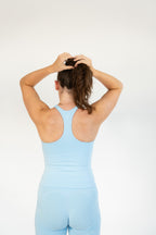 Lavoréa Ruched Waist Pocket Shorts worn with the Double Layer Racerback Top, both in Light Blue organic cotton