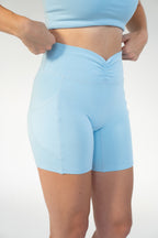 Lavoréa Ruched Waist Pocket Shorts in Light Blue, organic cotton, side view showing the deep pocket