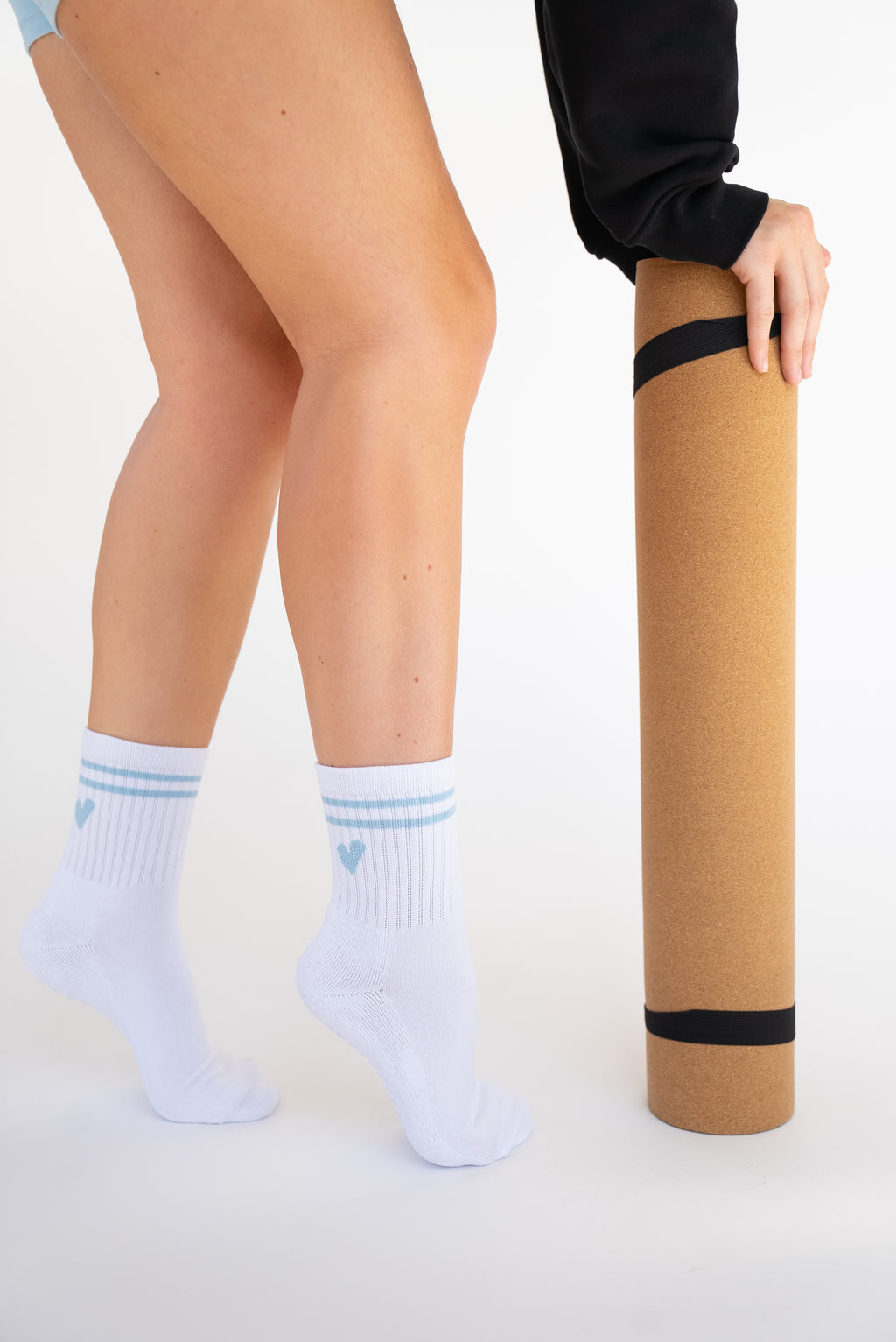 Lavoréa Everyday Socks in Light Blue, both feet standing with the ribbed cuffs in view